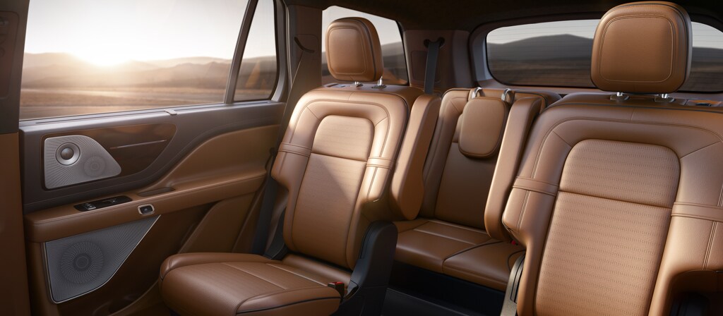 The lush, leather-trimmed second-row seats of a Lincoln Aviator® Black Label®