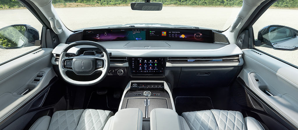 The panoramic display spans the width of a 2025 Lincoln Black Label Navigator® SUV with the Atmospheric interior theme