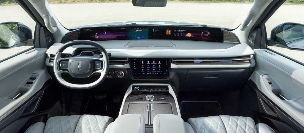 The panoramic display spans the width of a 2027 Lincoln Navigator® Black Label™ model with the Atmospheric interior theme