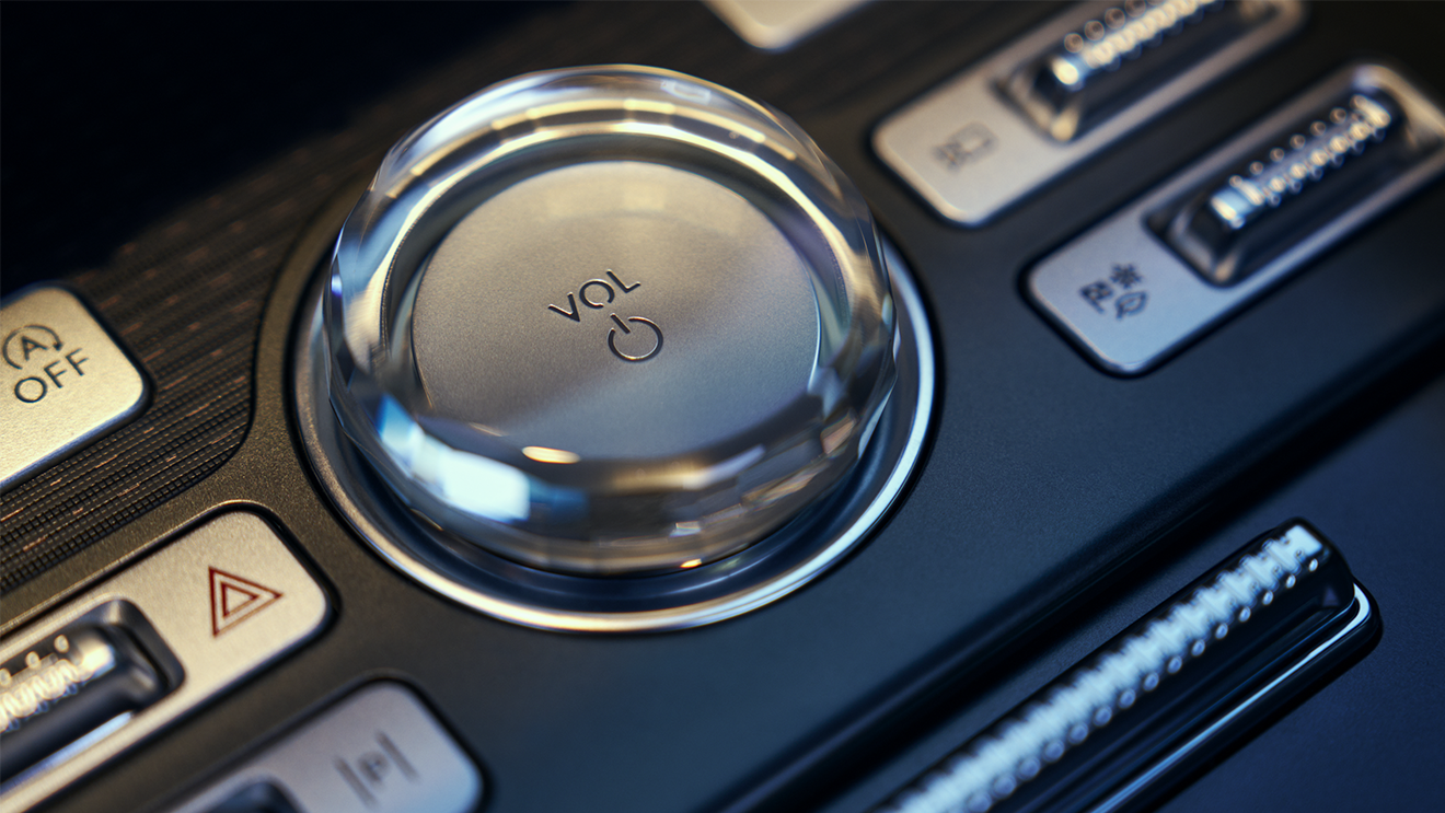 Close-up of the volume control knob and buttons on the Lincoln centre console.