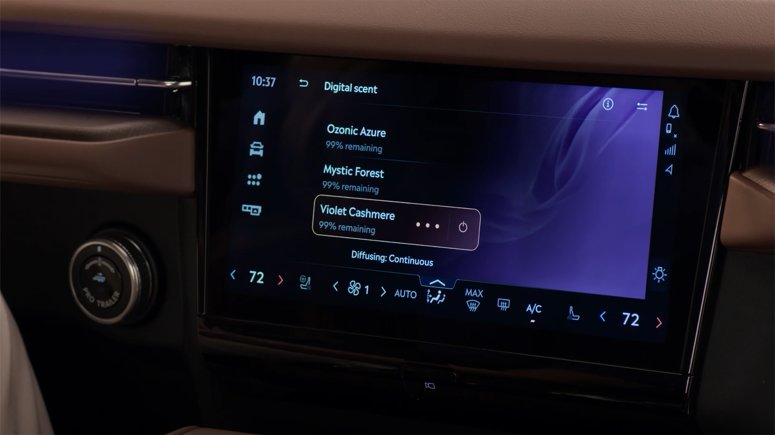Close-up of a hand inserting a Lincoln Digital Scent cartridge into a slot inside the center console.