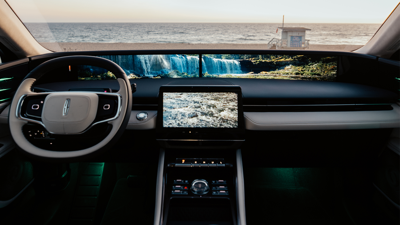 Interior view of the Lincoln cabin showing the steering wheel, centre touchscreen, and Panoramic Display.