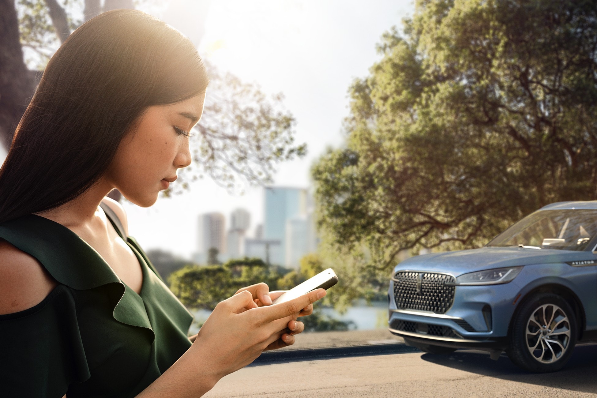 A woman is on her phone using the Lincoln Way App