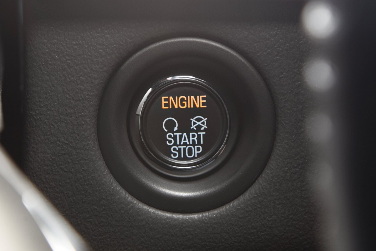 The button for the push button start system is shown in the dashboard of a Lincoln vehicle