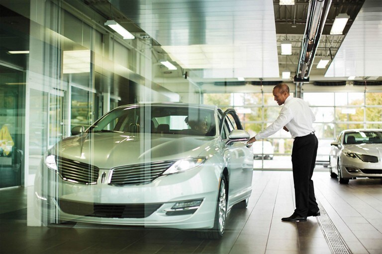 A 2018 Lincoln M K C in the Ingot Silver exterior color is on display at a Lincoln dealer