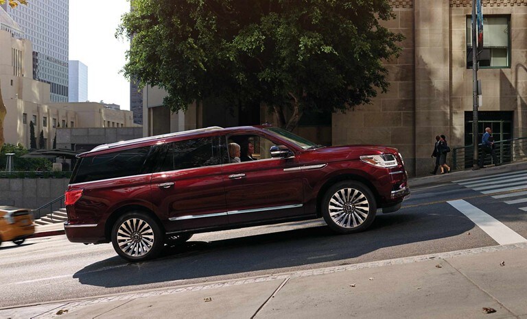 A red Lincoln Navigator on an incline demonstrating the Auto Hold feature