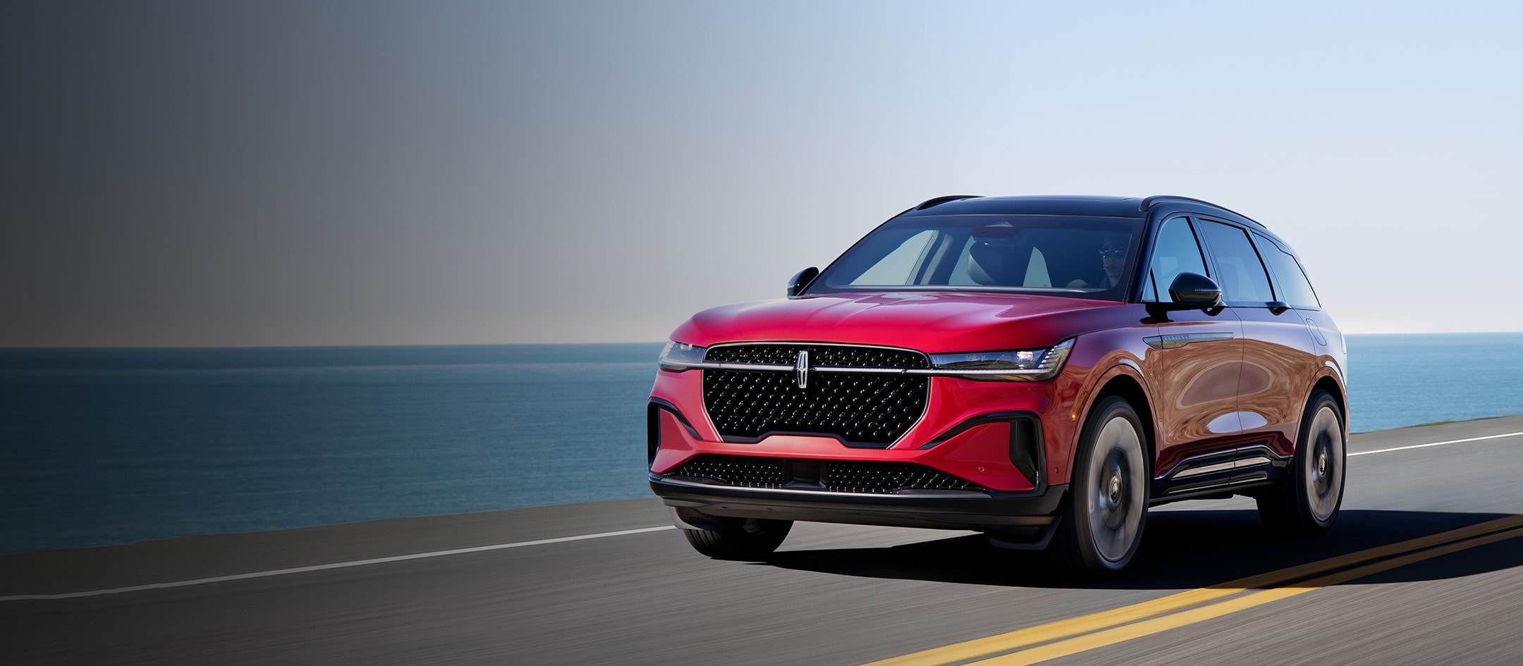 The 2025 Lincoln Nautilus SUV is driving on a road.