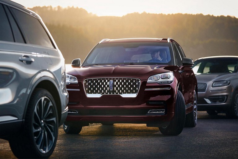 2023 Lincoln Aviator® Grand Touring is shown using the Active Park Assist 2.0 system to park between 2 other vehicles