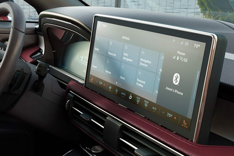 The centre touchscreen of a 2023 Lincoln Corsair SUV displays SYNC® 4 settings