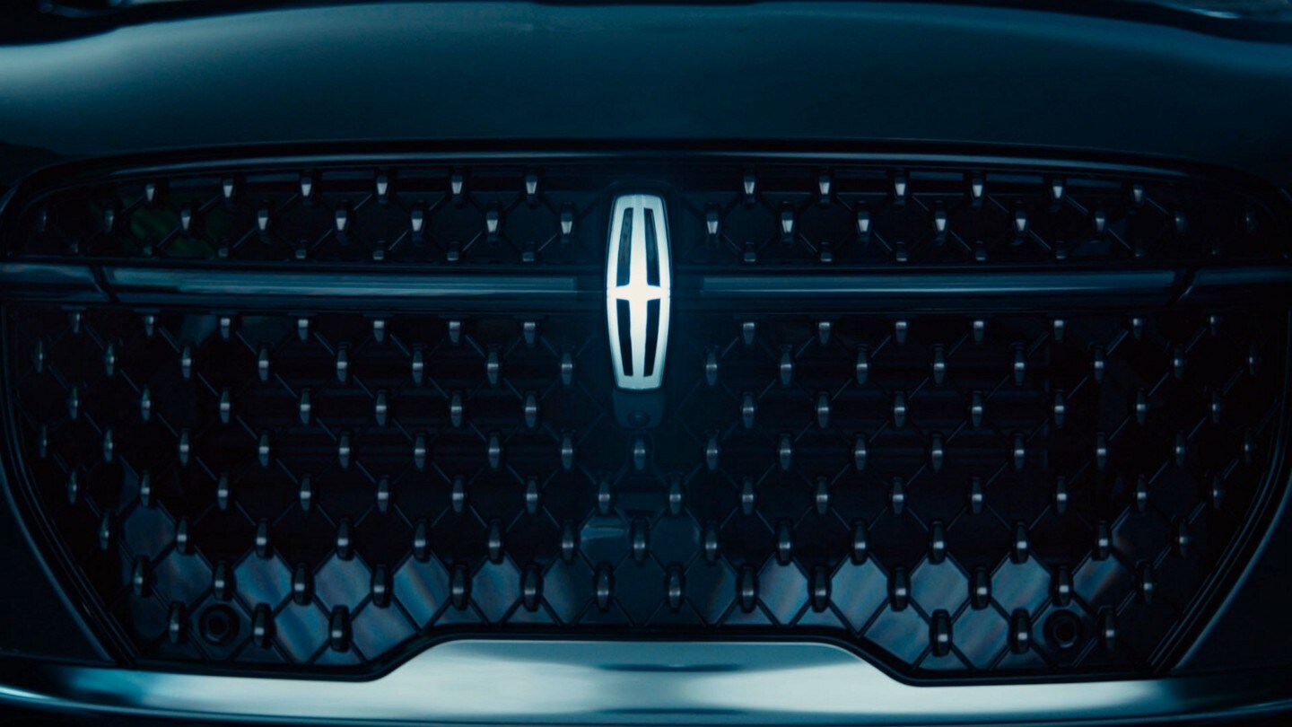 The Lincoln Star Logo in the grille of a 2024 Lincoln Nautilus SUV is stylishly illuminated