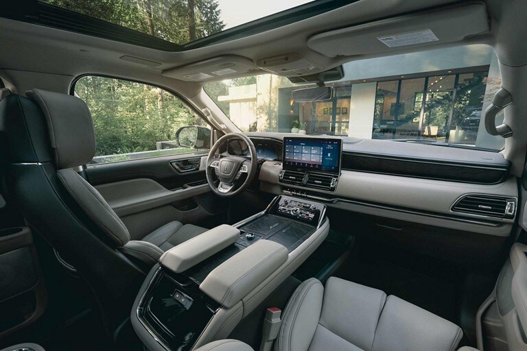 The front-row cabin of a 2024 Lincoln Navigator SUV shows off comfortable Perfect Position front seats