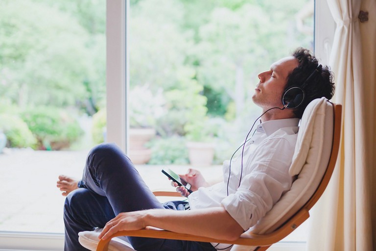 Man relaxing listening to music