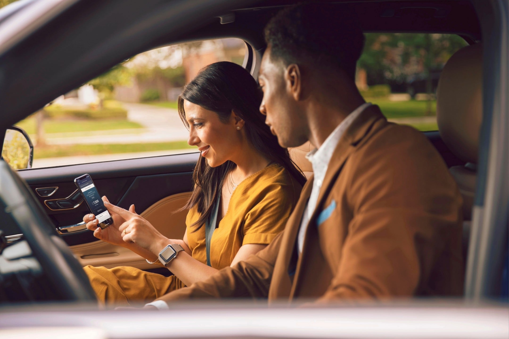 Woman walking towards a Lincoln Canada vehicle