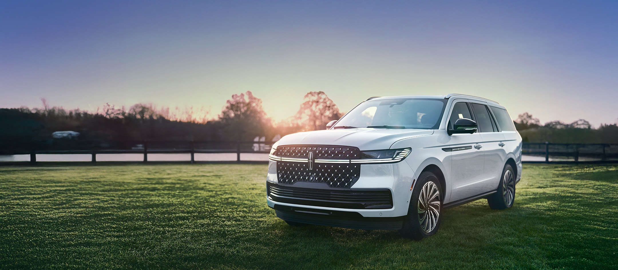 The 2026 Navigator parked on the grass.