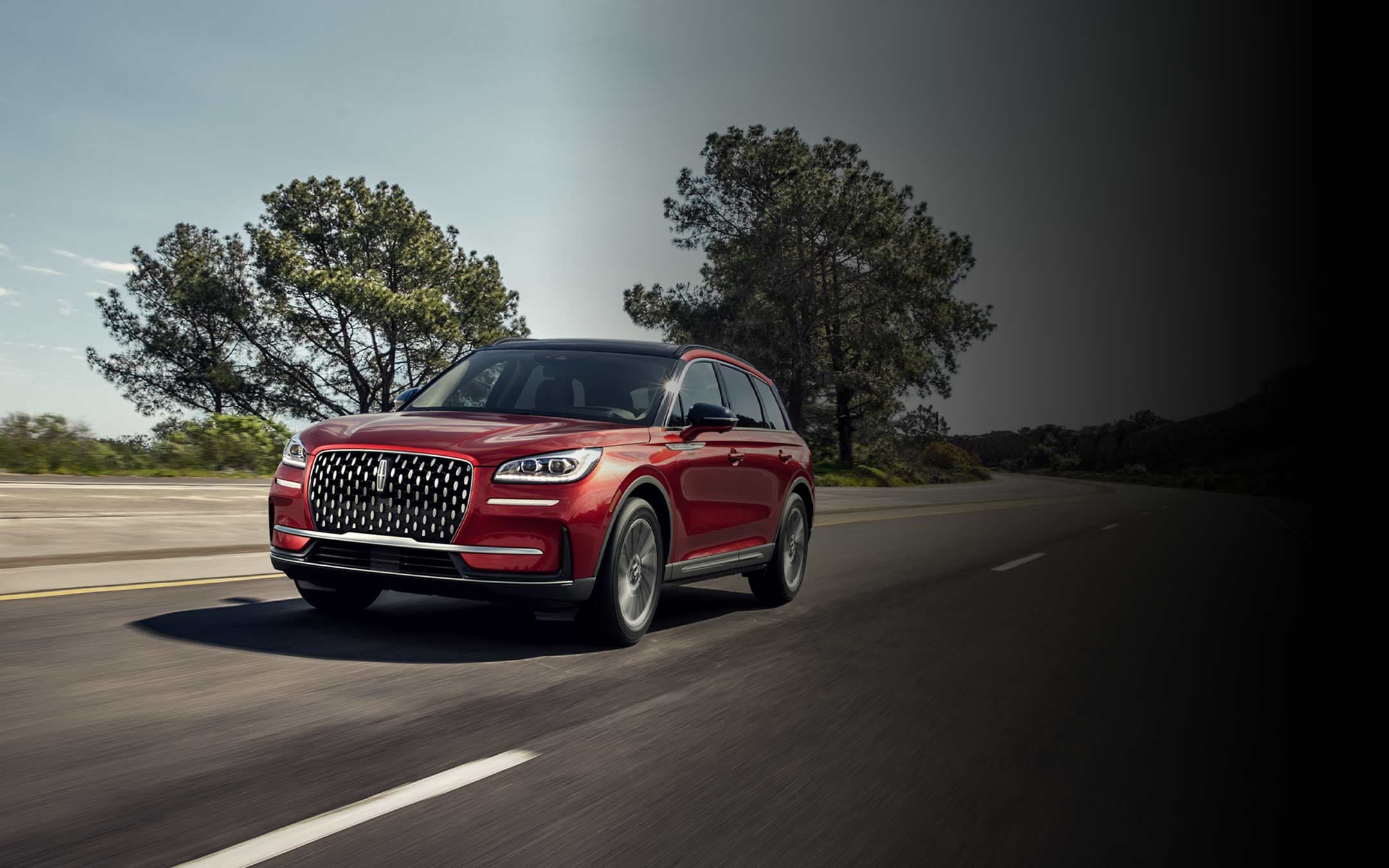 A 2026 Lincoln Corsair SUV is being driven on a country road