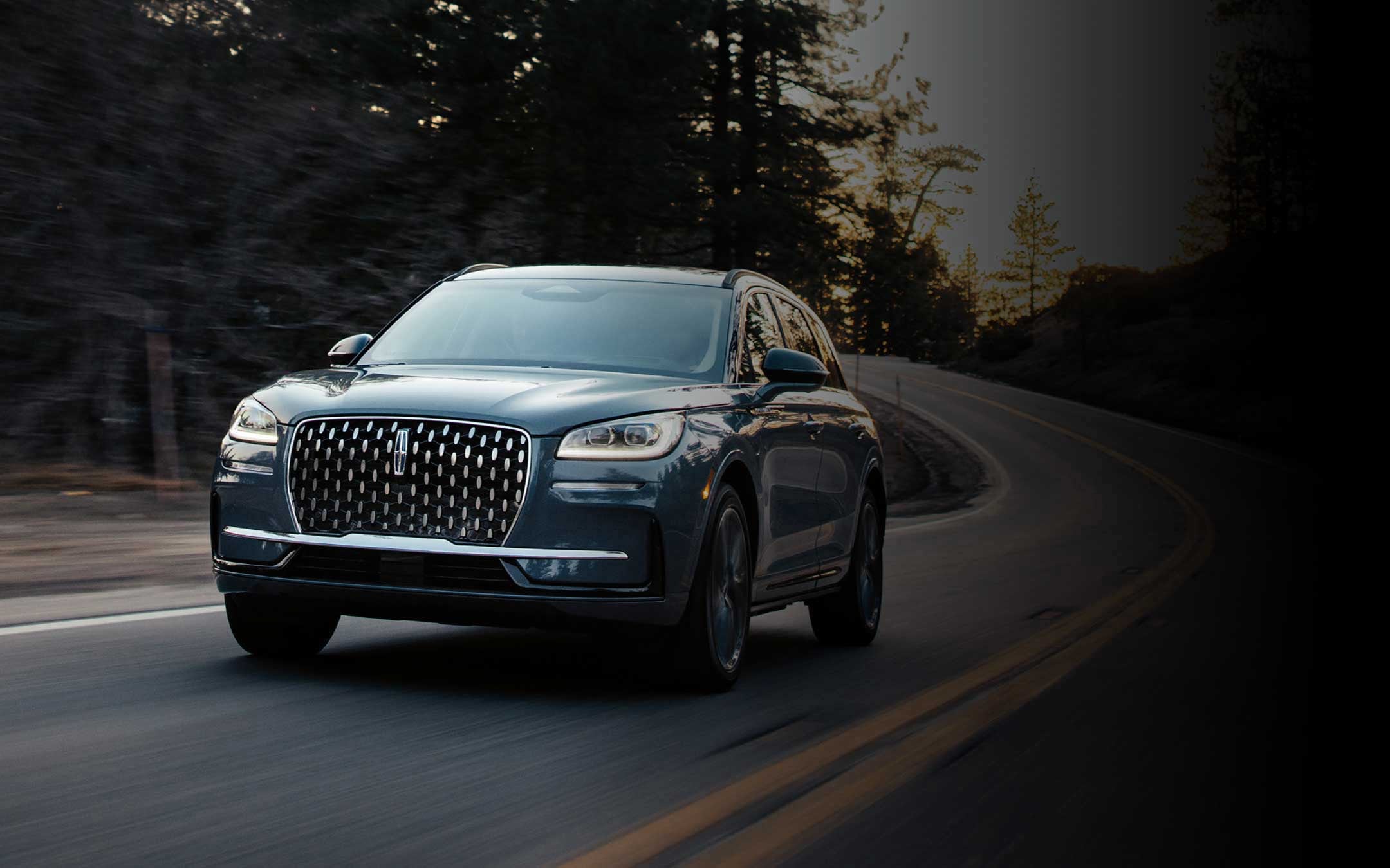 2026 Lincoln Corsair Reserve model in the Whisper Blue exterior colour is driven on a country road