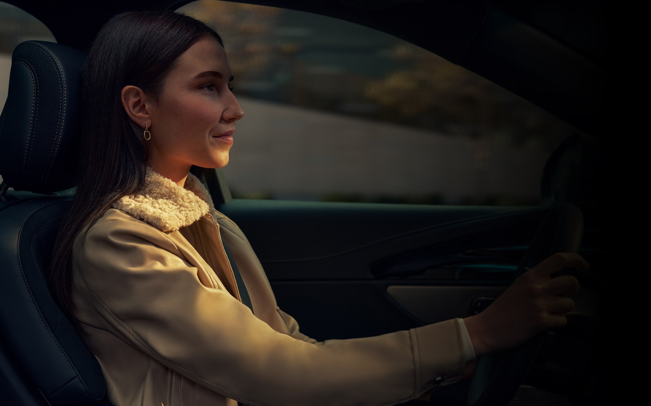 A woman driving a 2026 Lincoln Nautilus