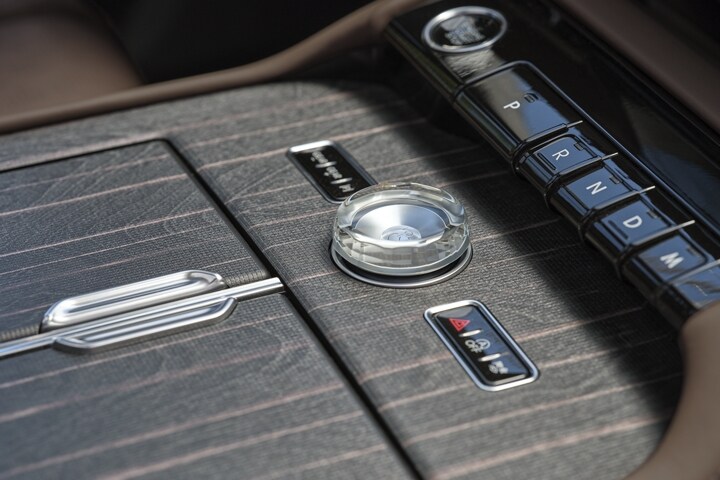 Real wood appliqués of the centre console of 2025 Lincoln Black Label Navigator.