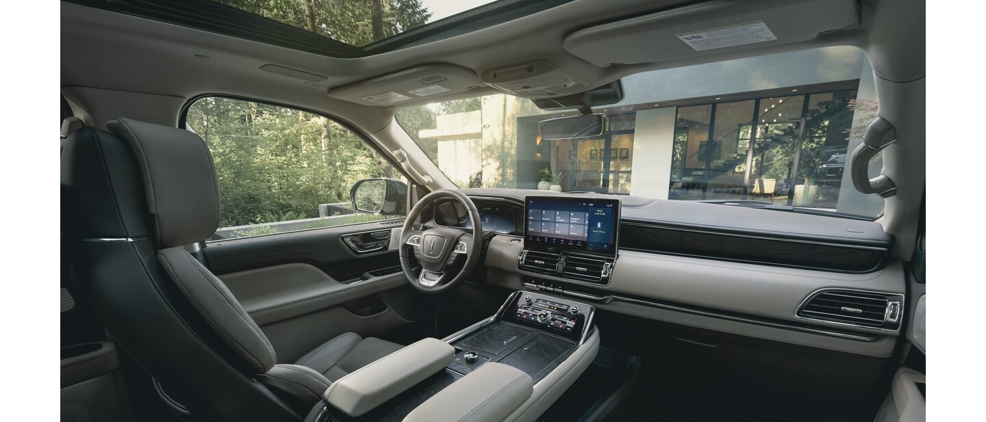 Interior of a Lincoln vehicle showing a SYNC screen