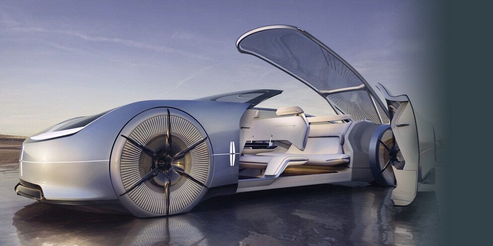 The Lincoln Model L100 concept vehicle is shown here with the glass roof and reverse-hinged doors open.