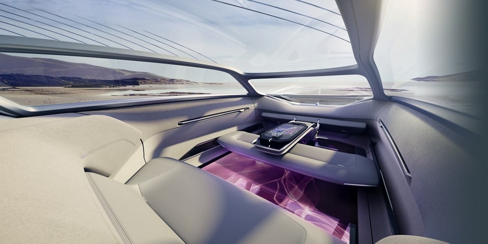 The interior of the Lincoln Model L100 concept vehicle is shown here with a pink design on the digital floor.