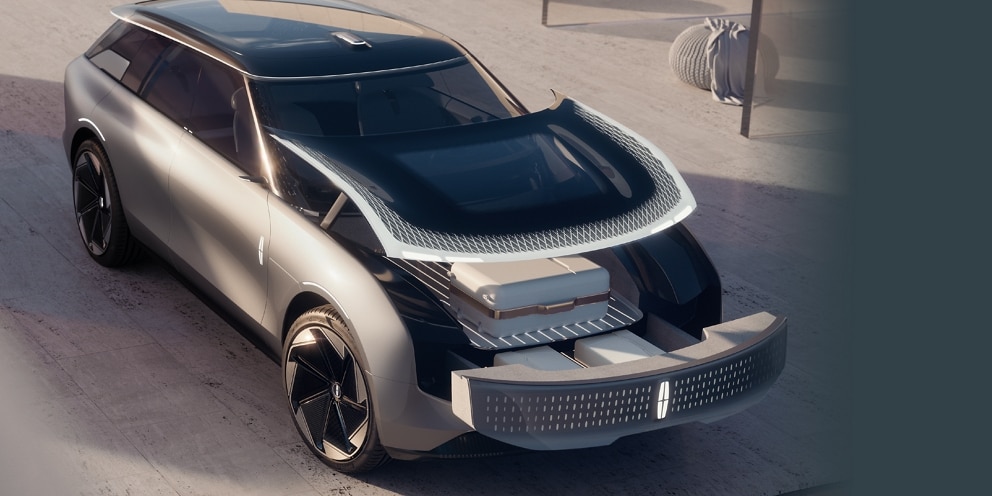 The Lincoln Star Concept vehicle is shown here with the front hood open to reveal a suitcase in the storage area of the front trunk, or “frunk.”