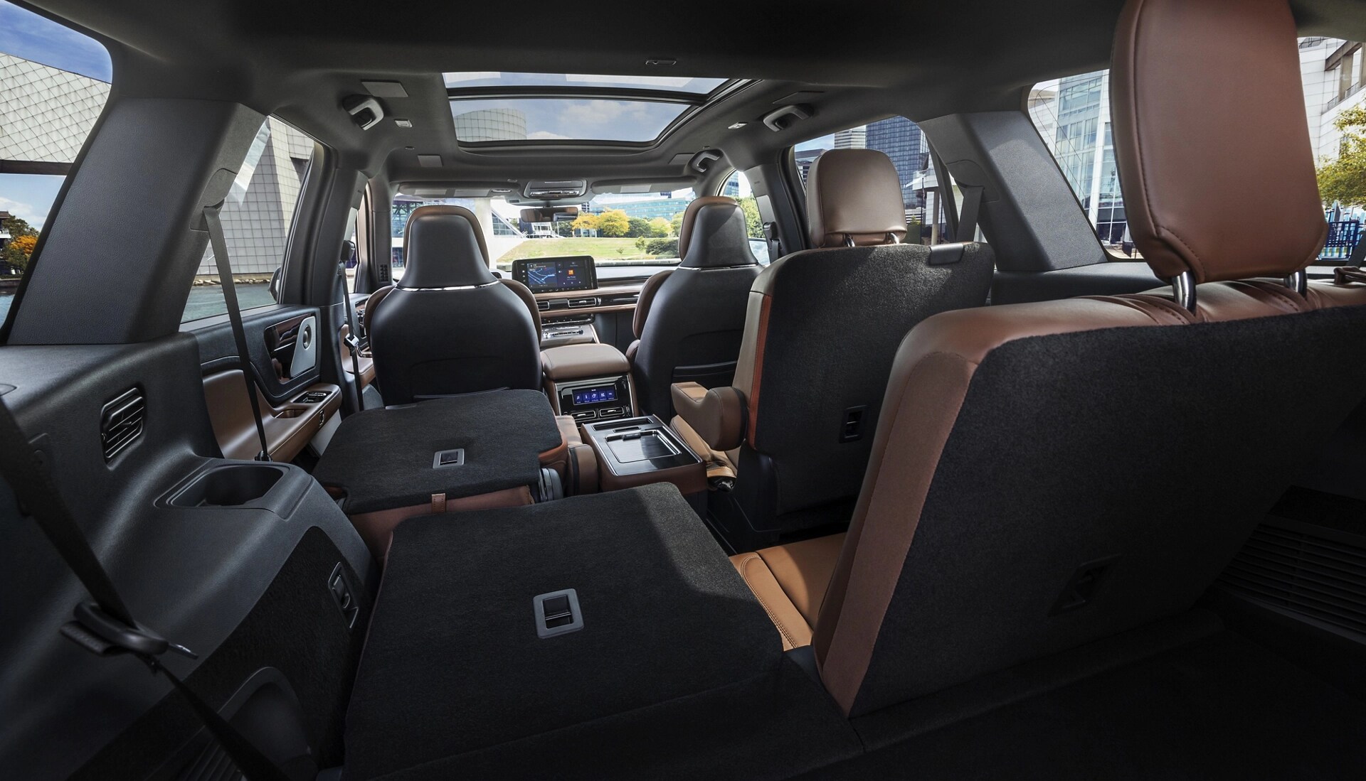 One side of the PowerFold® third-row seat and a second-row seat are folded forward in the 2026 Lincoln Aviator® SUV