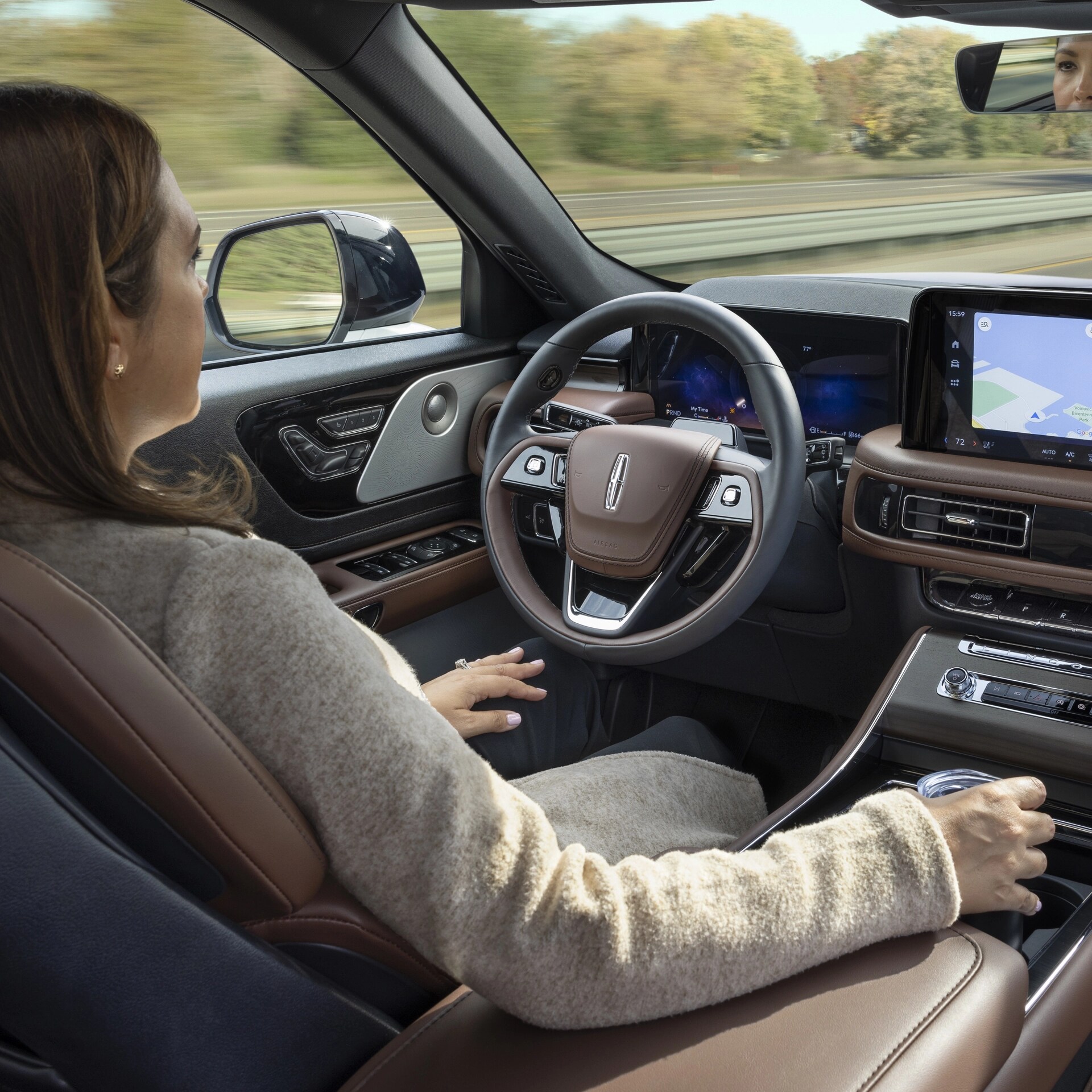 A 2026 Lincoln Aviator® SUV is being driven hands-free on a highway