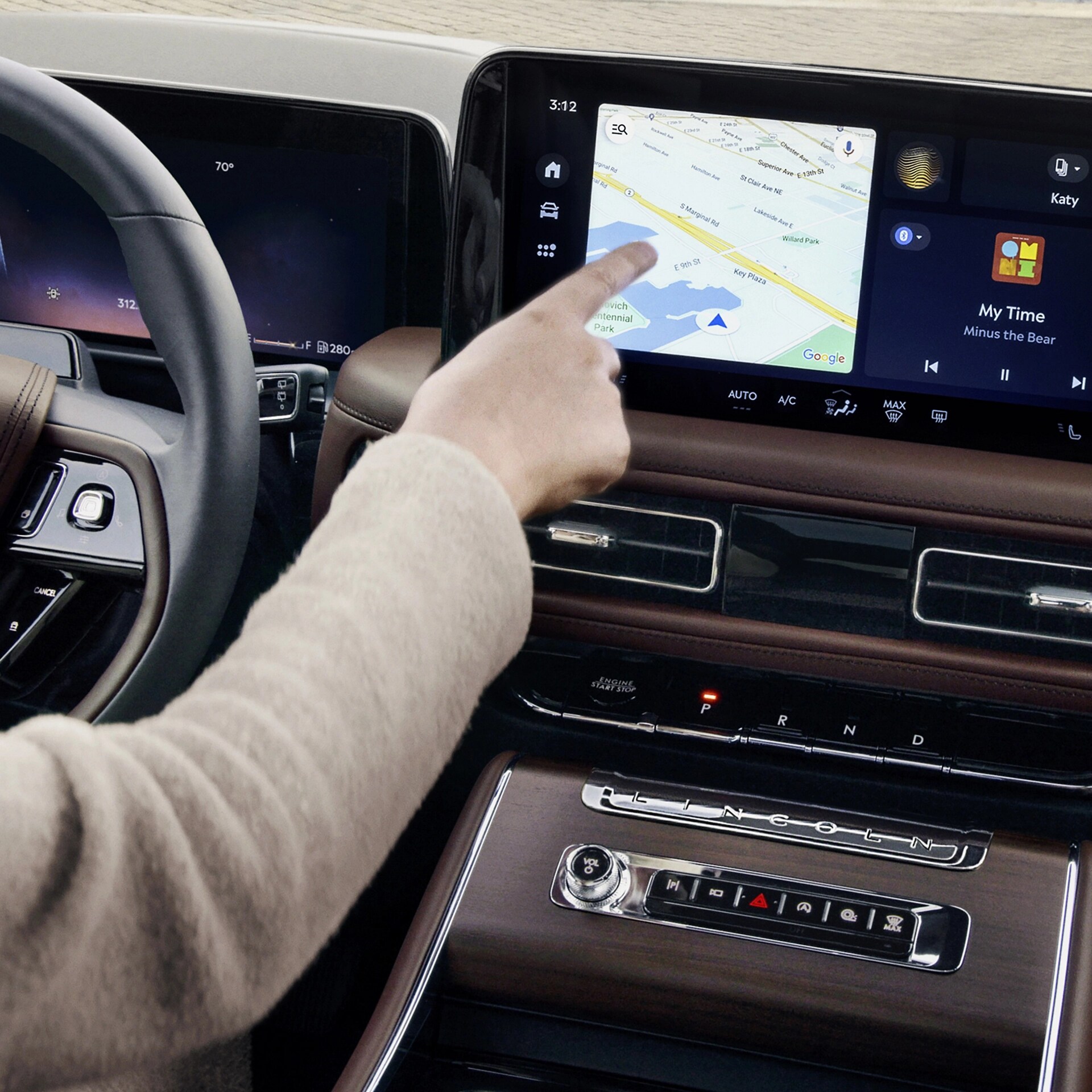 A person is tapping the centre-stack touchscreen display of a 2026 Lincoln Aviator® SUV