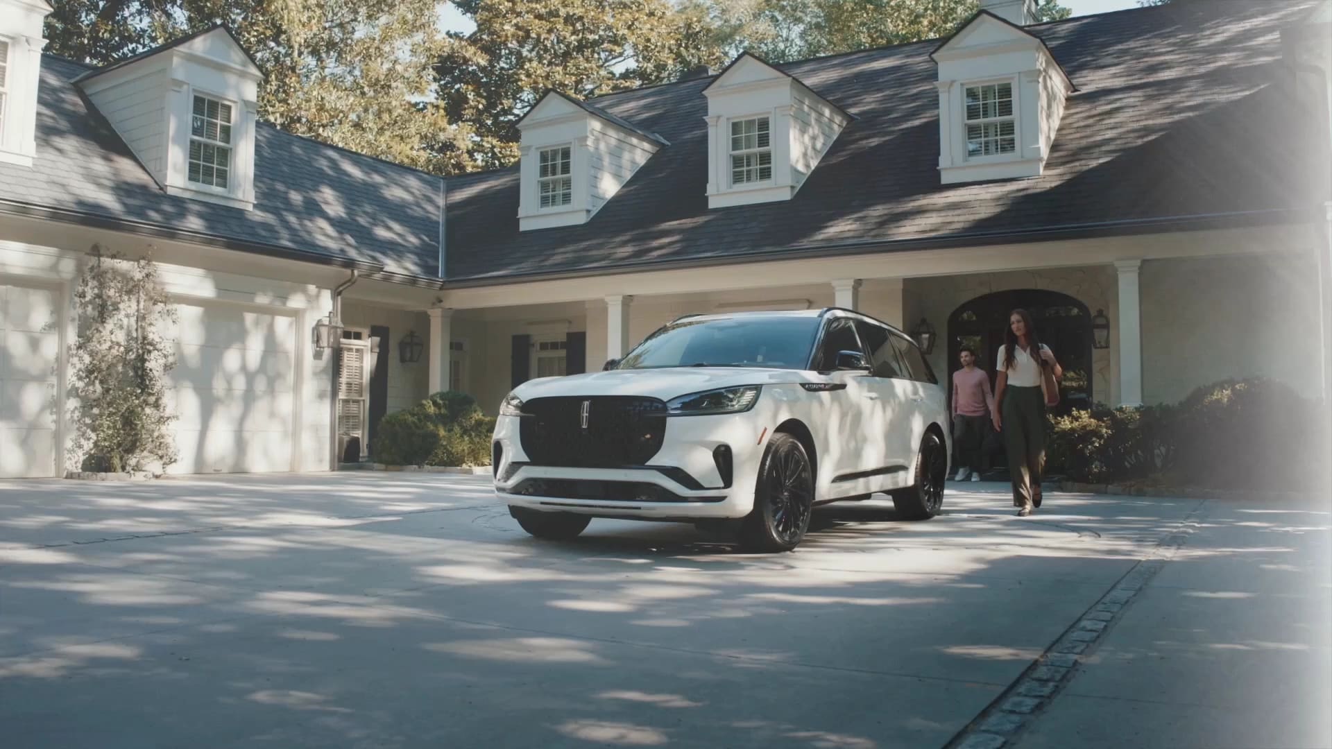 A couple approach a 2026 Lincoln Aviator