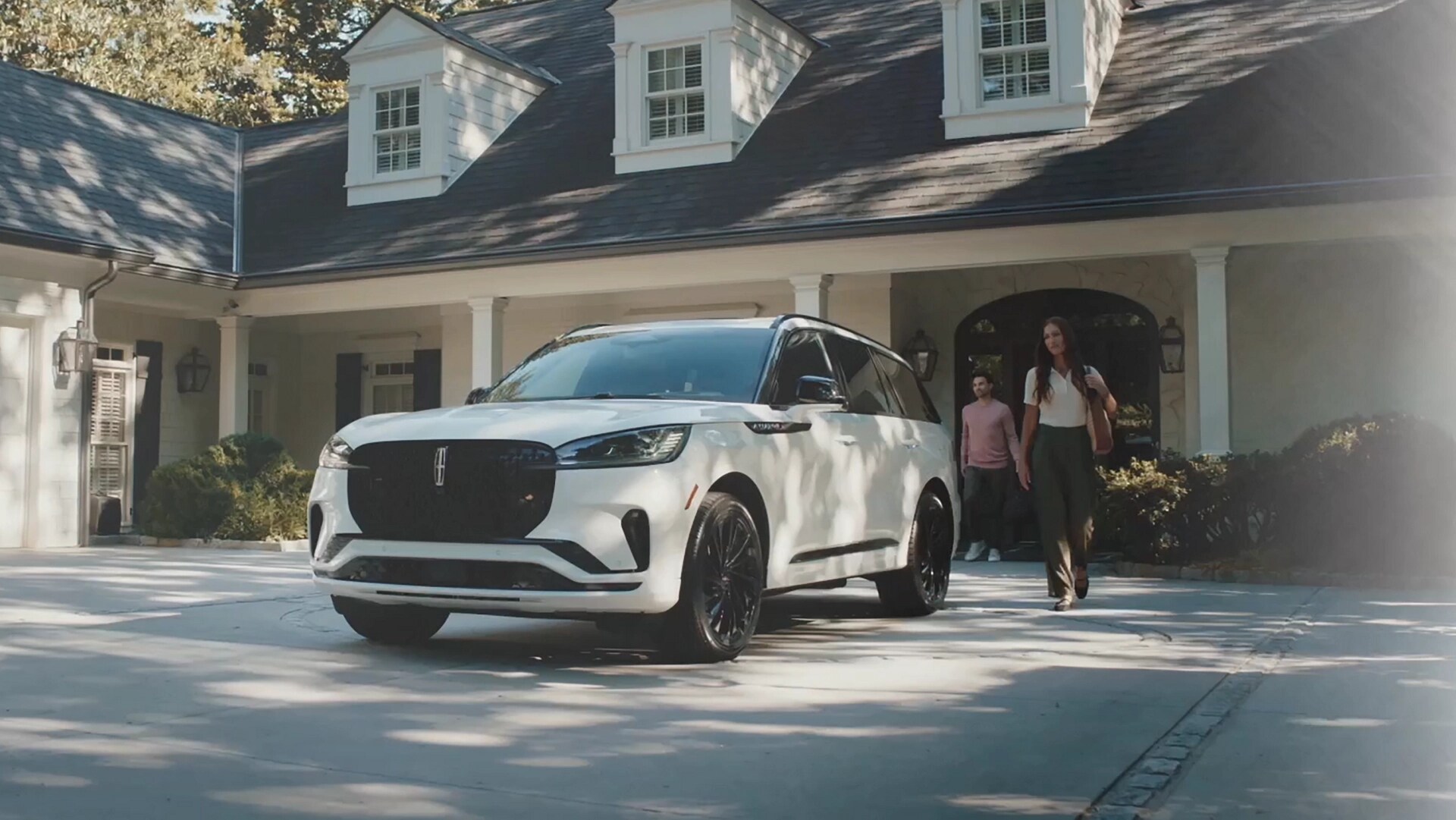 A couple approach a 2026 Lincoln Aviator