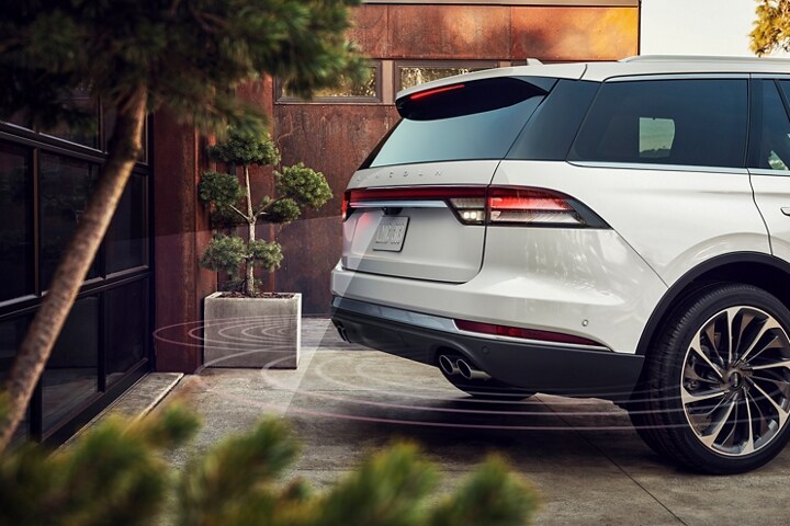 2023 Lincoln Aviator® backing up toward a garage door