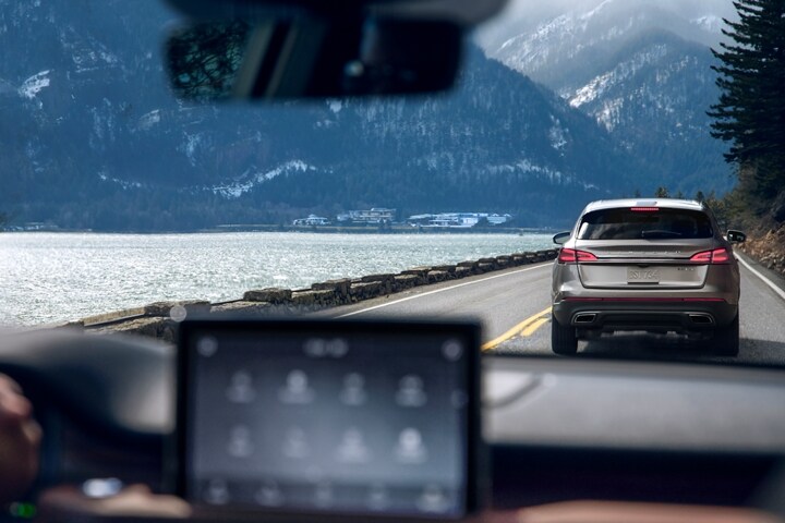 A braking vehicle is shown through the windshield of a 2023 Lincoln Aviator® to simulate the capabilities of Evasive Steering Assist