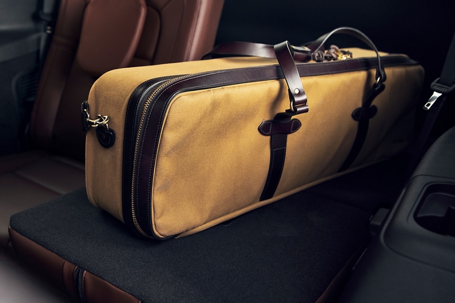Large oblong bag rests on one of the 3rd-row seats of a 2023 Lincoln Aviator® that has been folded flat