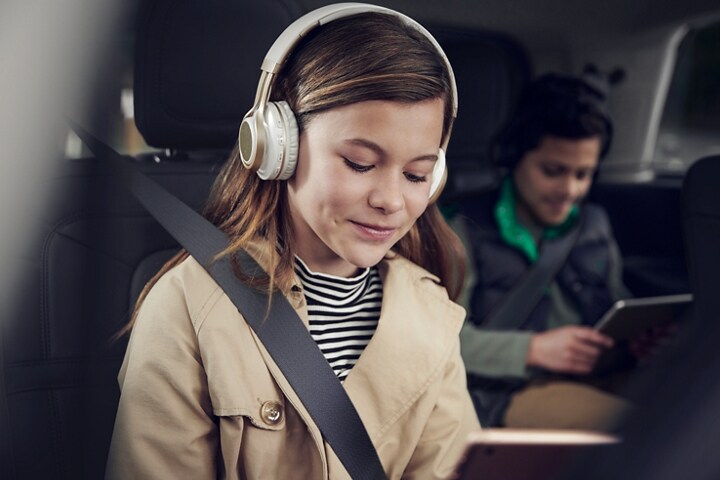 Passengers in the 2nd and 3rd rows of a 2023 Lincoln Aviator® use the 4G LTE Wi-FI Hotspot