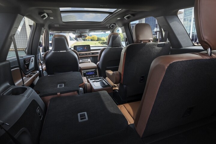 One side of the PowerFold® 3rd-row seat and a second-row seat are folded forward in the 2025 Lincoln Aviator