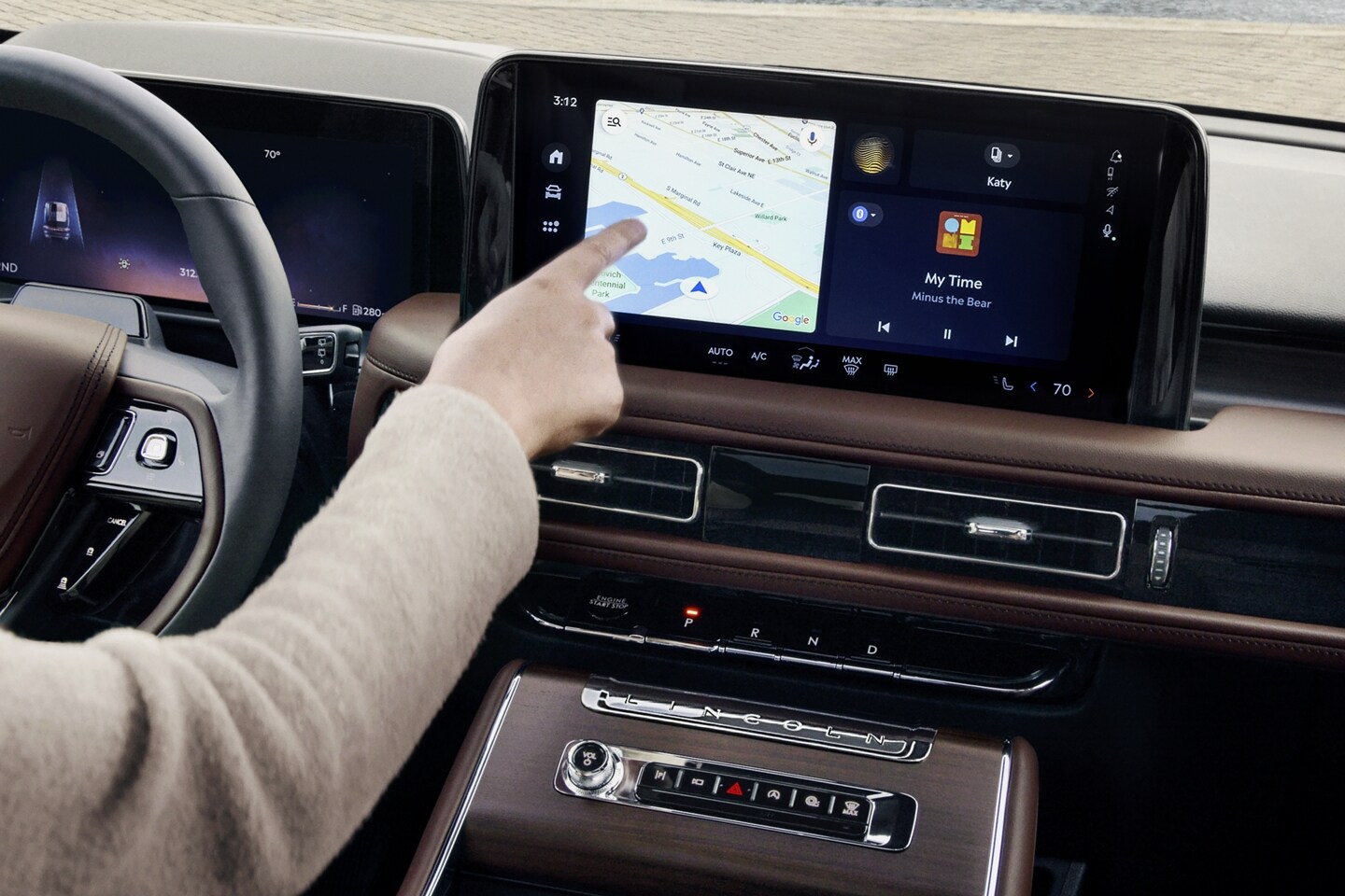 A person is tapping the centre-stack touchscreen display of a 2025 Lincoln Aviator