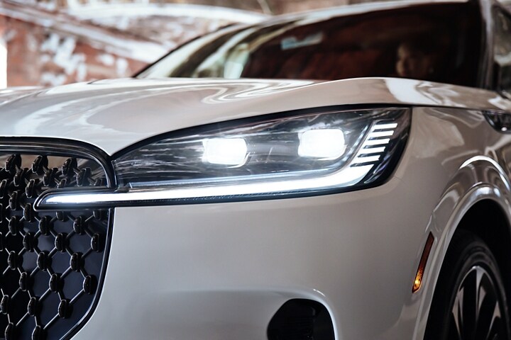 The front left headlamp of a 2025 Lincoln Aviator is shown