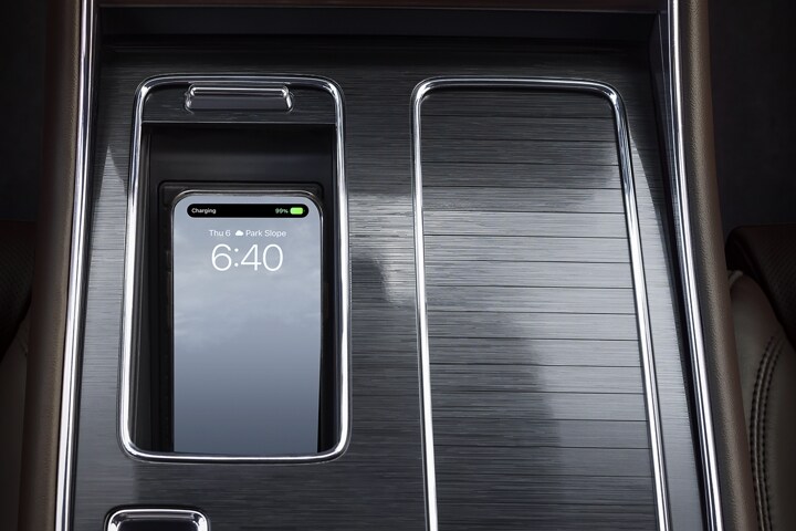 A mobile device is placed on a wireless charging pad