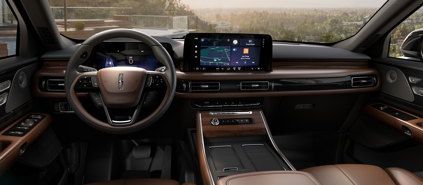 A 2025 Lincoln Aviator Reserve interior is shown in Onyx and Harvest Bronze
