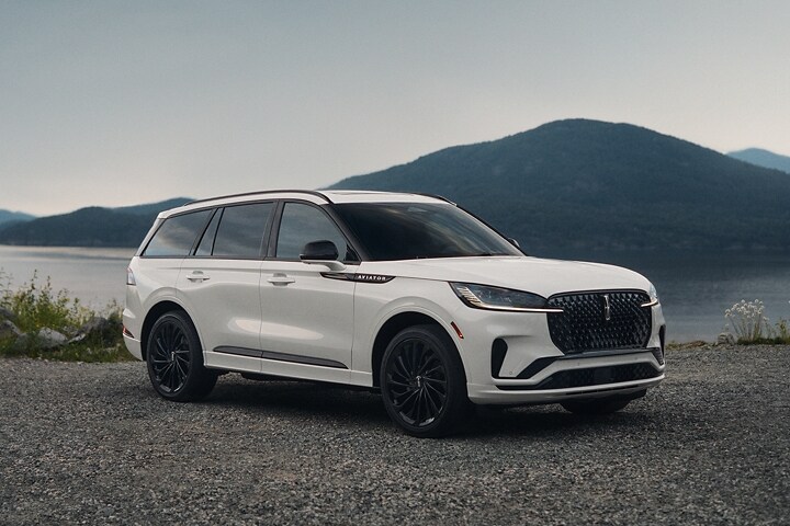 The 2025 Lincoln Aviator parked by a body of water.