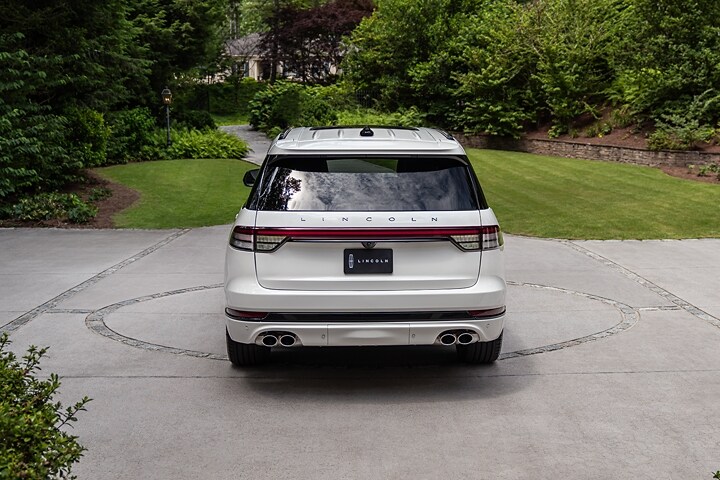 The 2025 Lincoln Aviator parked outside with the rear side shown.