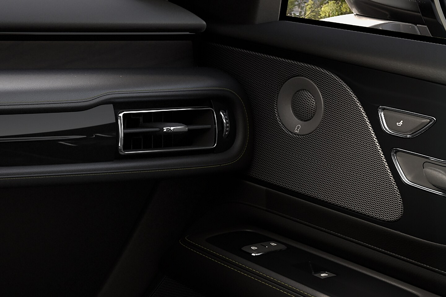 A Revel® speaker is shown on the interior door pane of a 2025 Lincoln Aviator