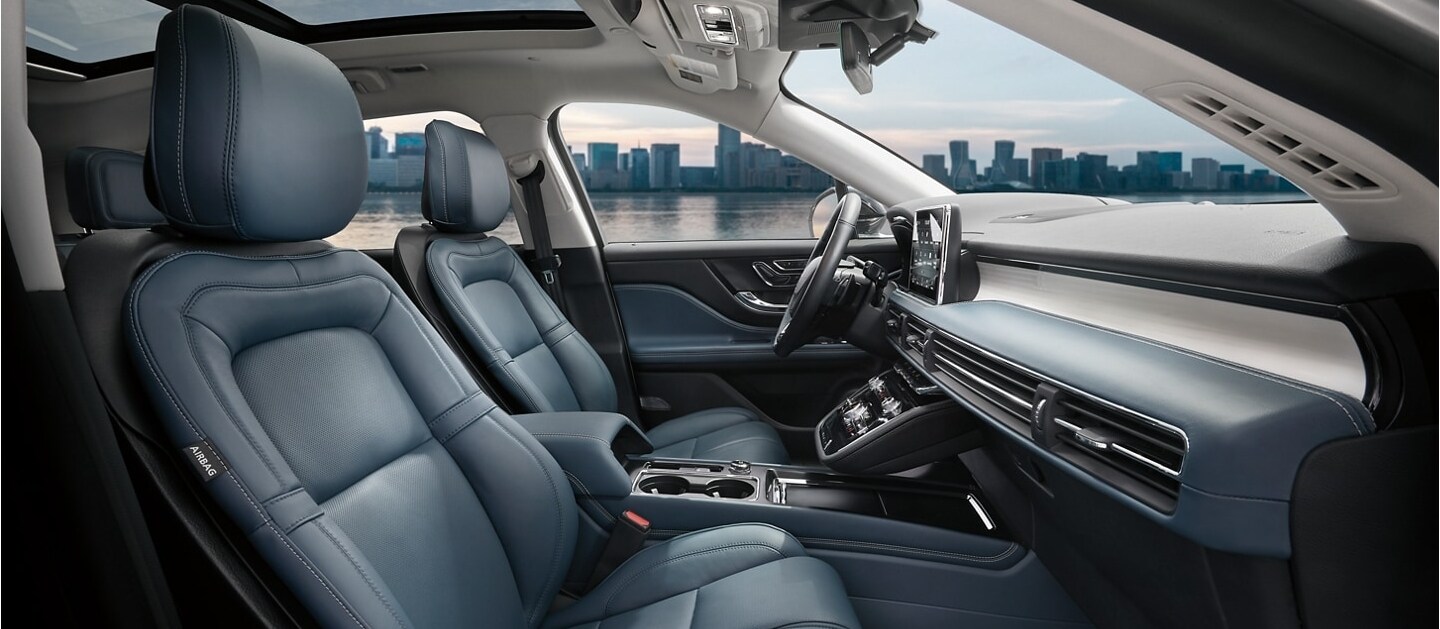 The Beyond Blue interior of a 2021 Lincoln Corsair shows a colour palette of deep blue and black materials with white stitching and floating chrome