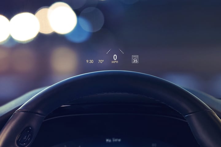 The head up display projects data on the windshield above the steering wheel inside a 2023 Lincoln Corsair SUV