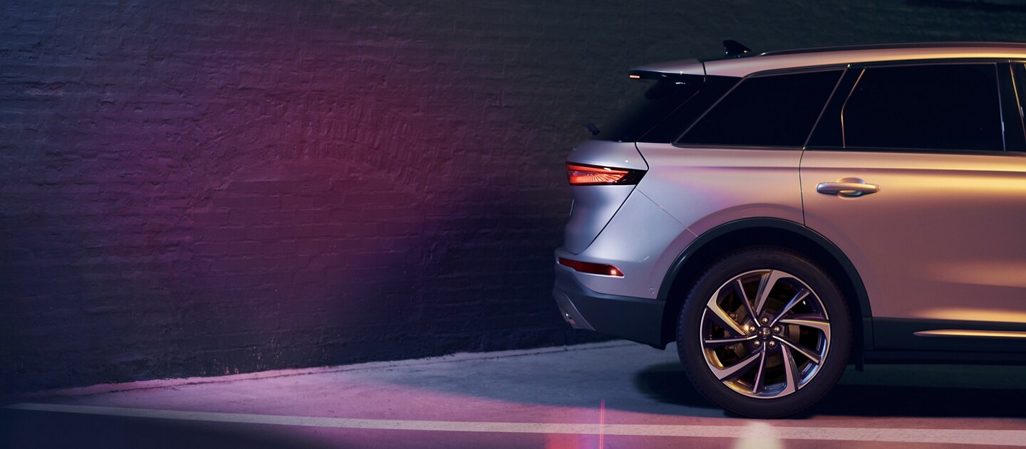 A 2023 Lincoln Corsair SUV is shown in reverse close to a wall