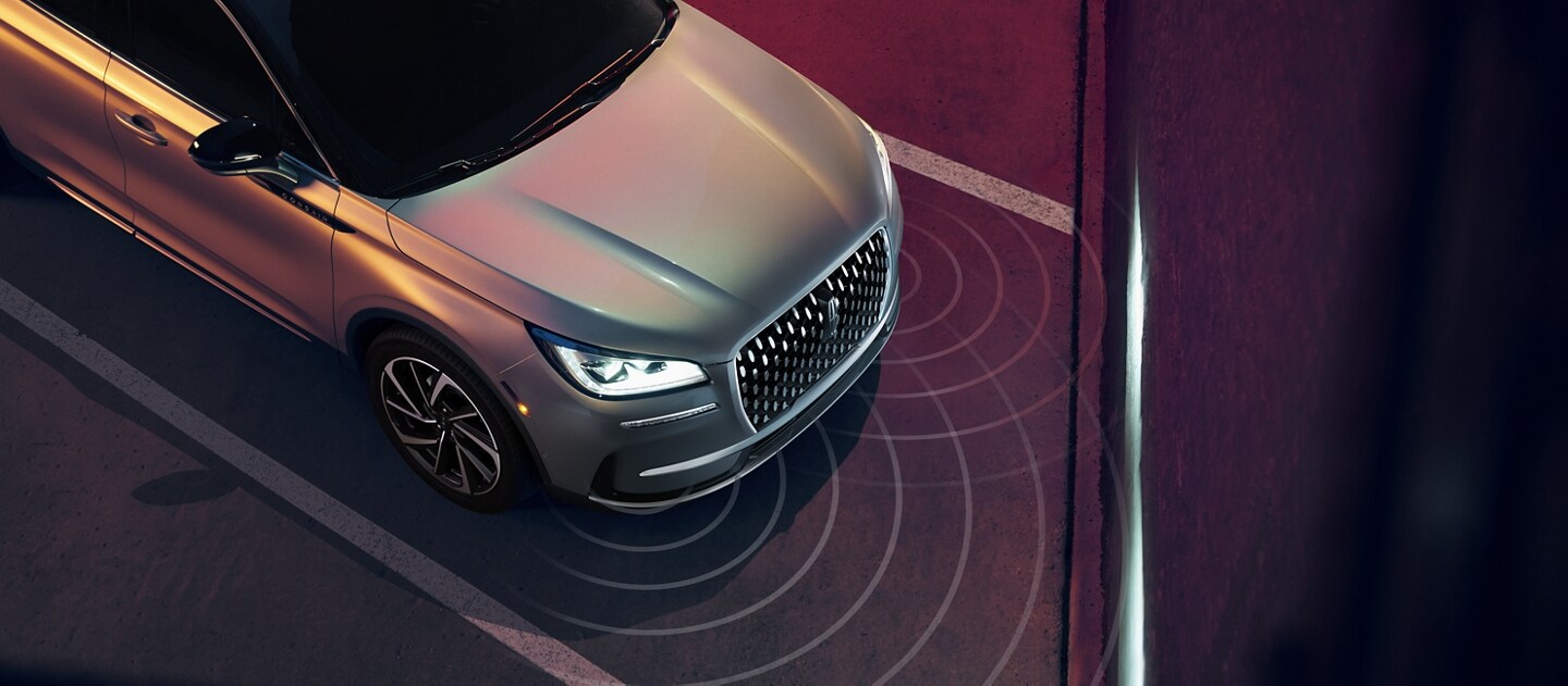Simulated sensor beams are shown being emitted from the front of a 2023 Lincoln Corsair SUV