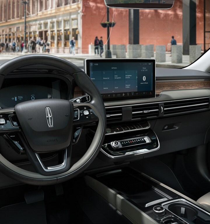 The centre touchscreen of a 2023 Lincoln Corsair SUV displays SYNC® 4 settings