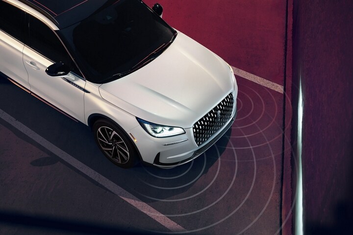 Simulated sensing waves emit from a 2025 Lincoln Corsair to demonstrate Pre-Collision Assist