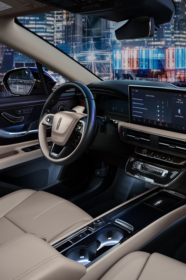 The interior of a 2025 Lincoln Corsair is shown in the Light Smoked Truffle interior colour